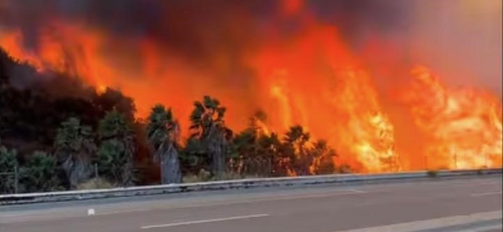 Montezuma fire rages next to the road